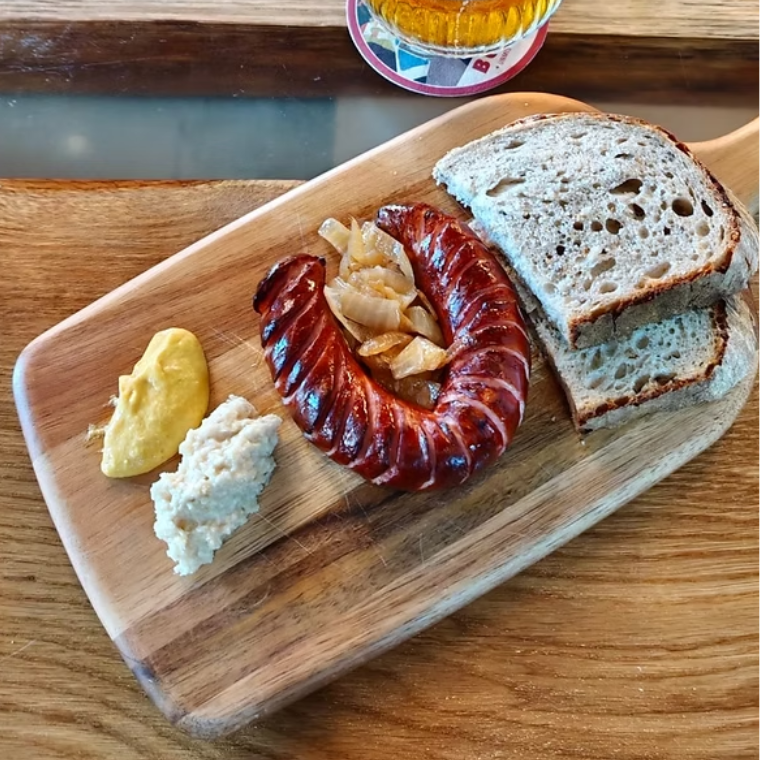 Treat yourself to a £10 grilled sausage at Tomo Tankovna!